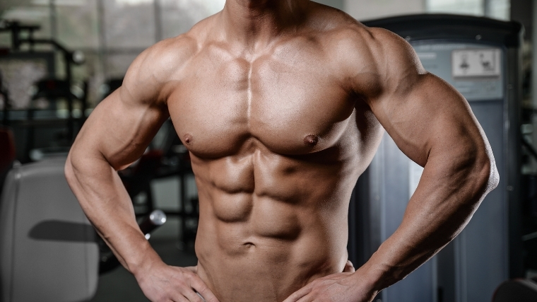 man flexing chest muscles